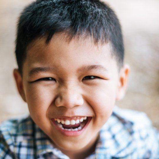 Child smiling after dentofacial orthopedics treatment