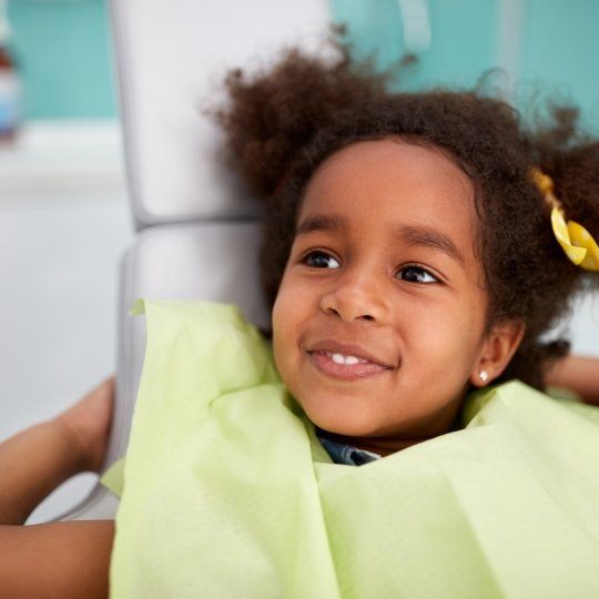 Young girl smiling during dentofacial orthopedics screening