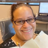 Orthodontic patient in treatment chair smiling