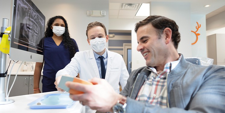 Orthodontist and patient reviewing treatment plans