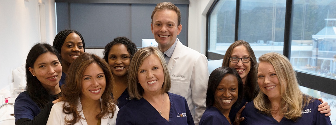 Orthodontist and team in orthodontic office