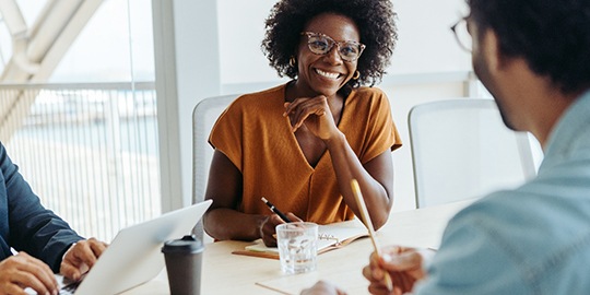 Smiling woman enjoying lunch outside