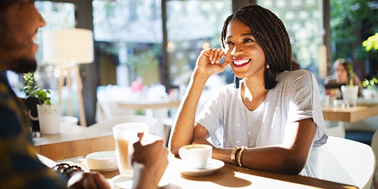 Woman smiling on coffee date