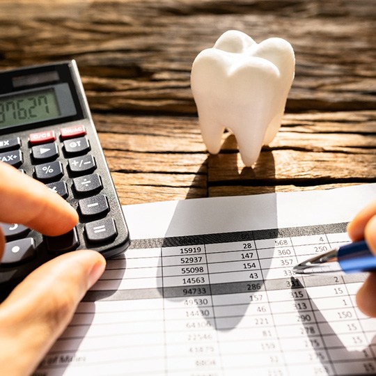 A patient calculating the cost of their orthodontic emergency
