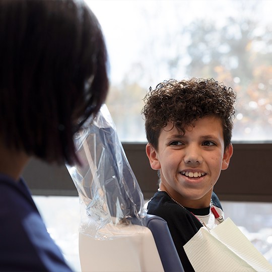 Orthodontic patient smiling at orthodontist