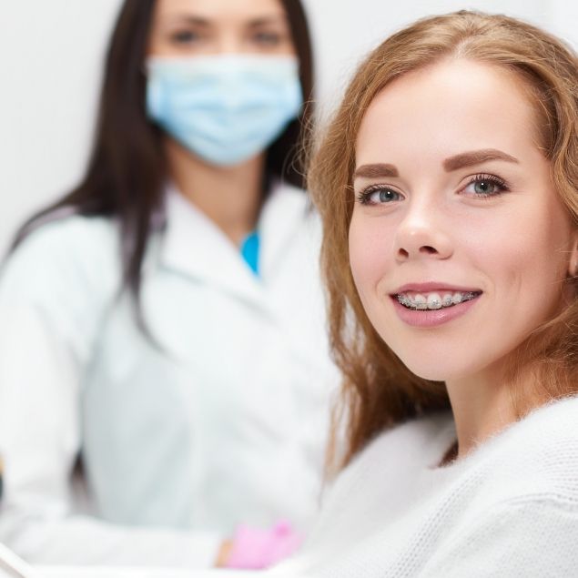 Woman receiving adult orthodontics smiling