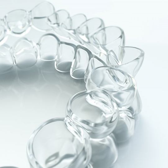 Closeup of nearly invisible Spark Clear Aligners in Atlanta