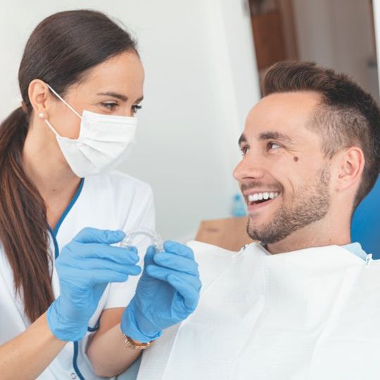 Patient and dentist discussing the cost of Spark Clear Aligners in Atlanta 
