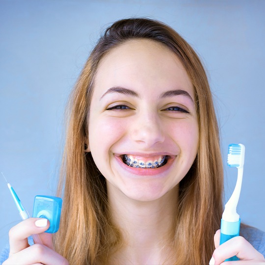 Smiling woman with self ligating braces