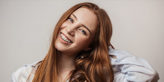 Woman smiling with ceramic braces