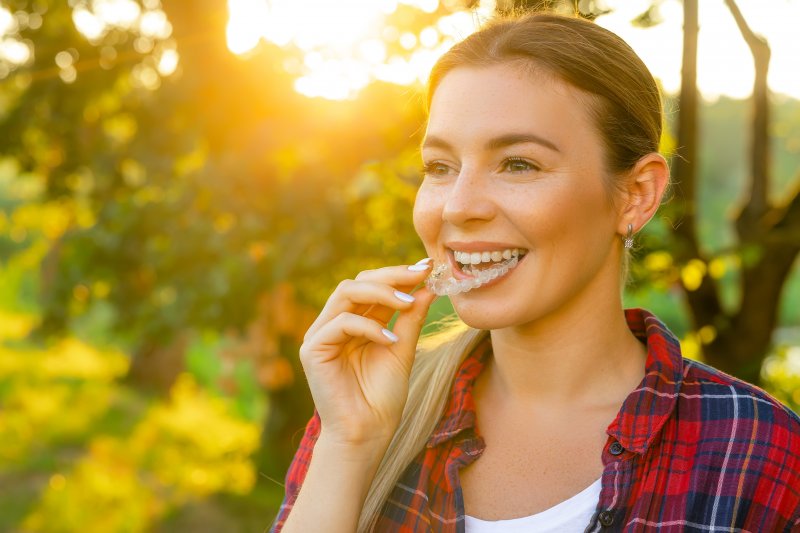 young woman wearing clear aligner