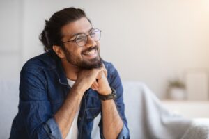 Man smiling during his second round of braces
