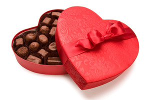 Heart-shaped box filled with chocolate for Valentine’s Day